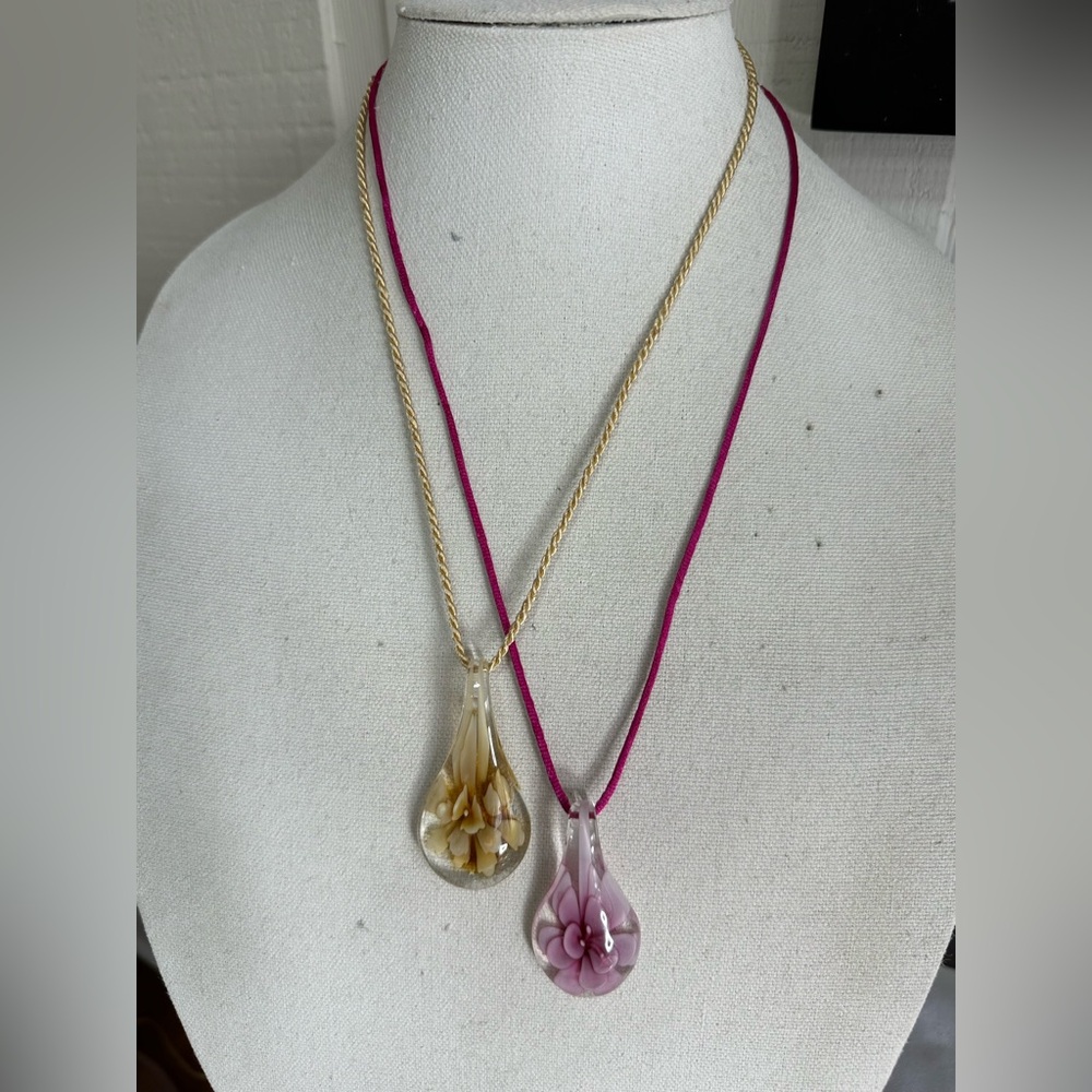 Two tear drop glass flower necklaces on satin cord